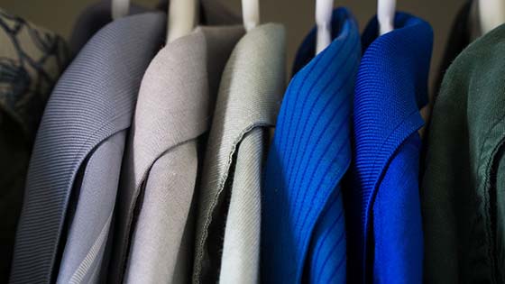 An image of jackets in a closet