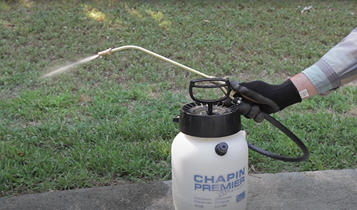 a portable sprayer being tested for use